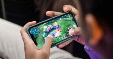 a person is playing a video game on their phone
