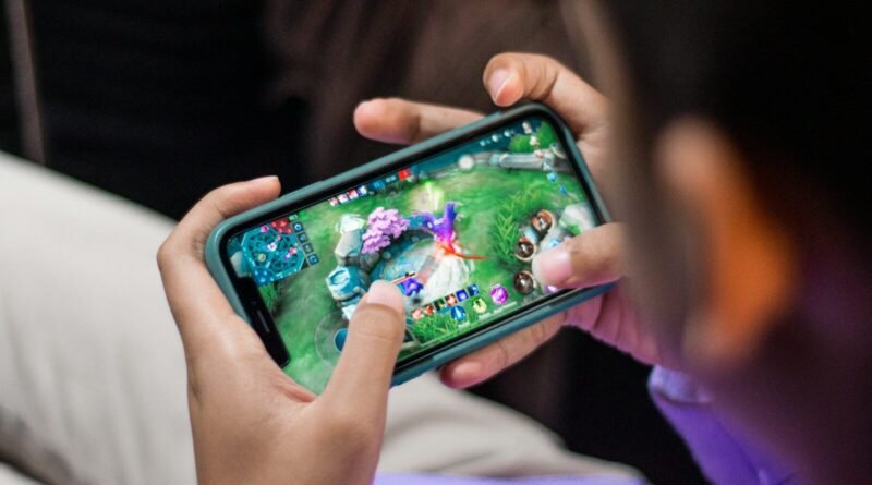a person is playing a video game on their phone
