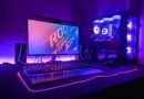 A gaming computer setup with a monitor, keyboard, and tower in purple